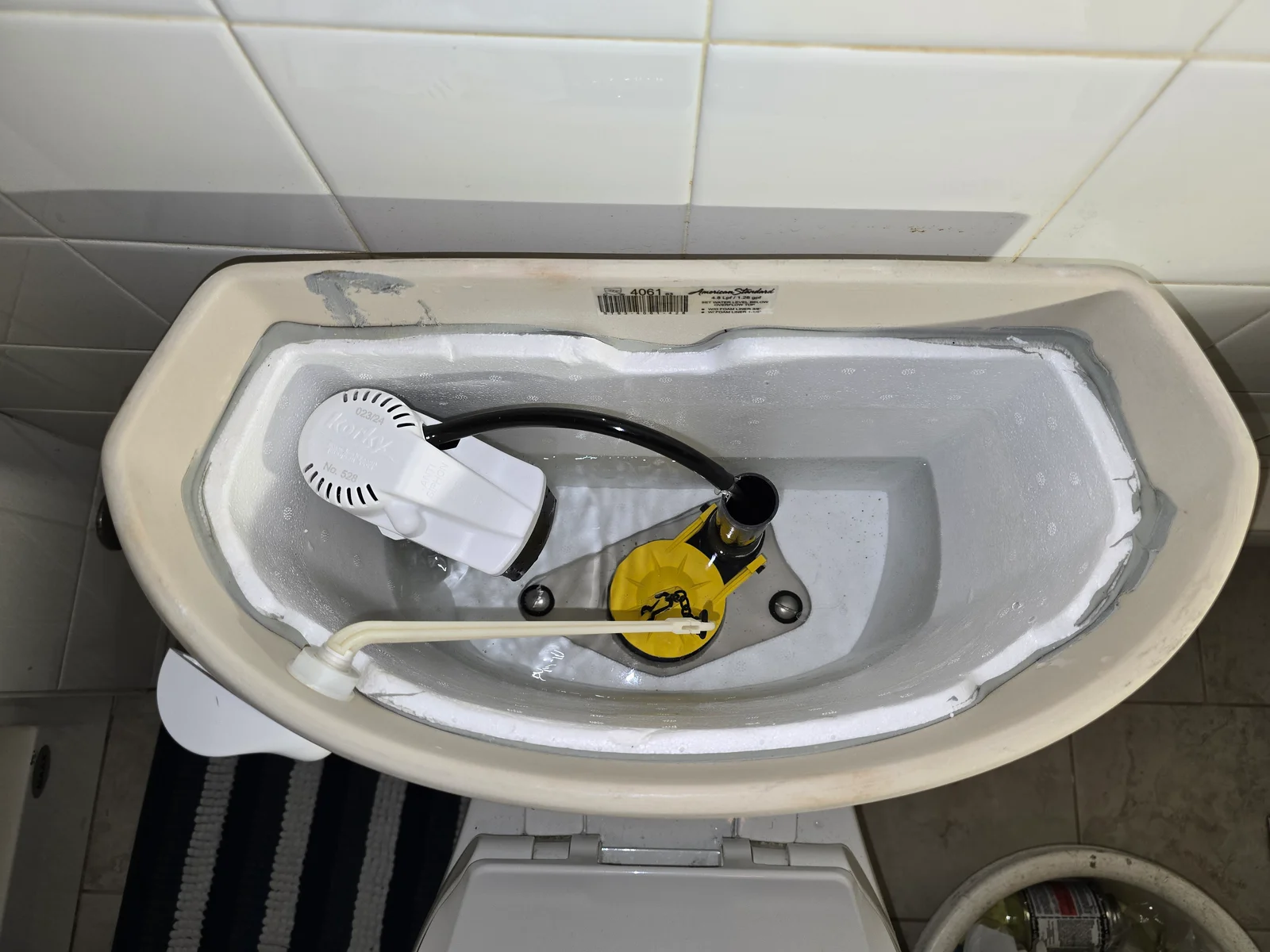 Licensed plumber repairing a toilet — Midtown Plumbing Vaughan